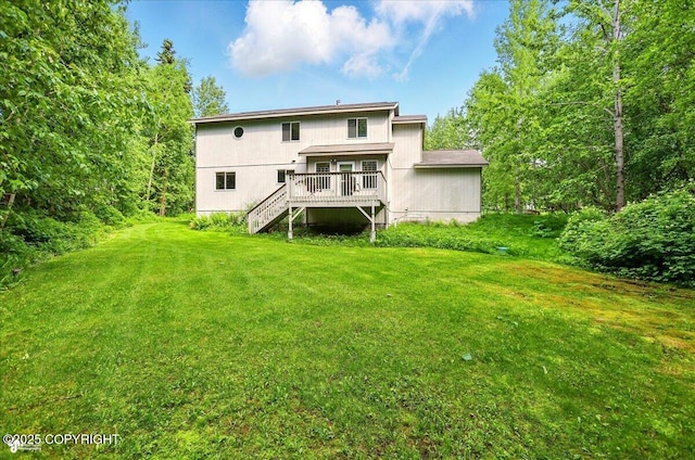 22030 Birch Creek Dr, Chugiak, AK 99567 - rear view of property with stairway, a lawn, and a deck