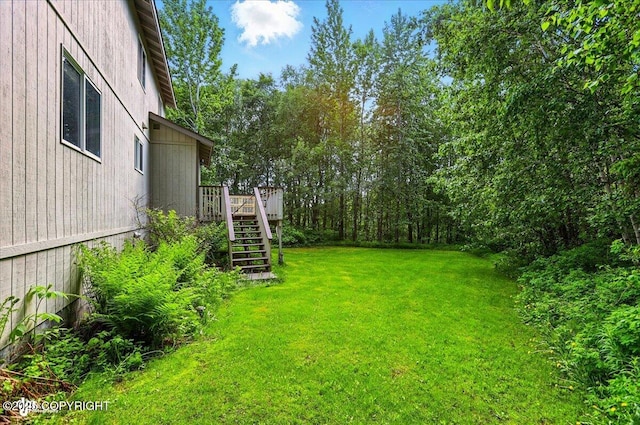 22030 Birch Creek Dr, Chugiak, AK 99567 - view of green lawn featuring stairs and a deck