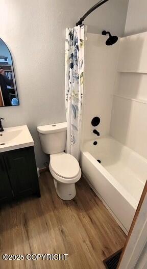 301 Teal Way, Kodiak, AK 99615 - full bath featuring wood finished floors, toilet, vanity, and shower / tub combo with curtain