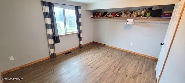 301 Teal Way, Kodiak, AK 99615 - unfurnished bedroom with wood finished floors and baseboards