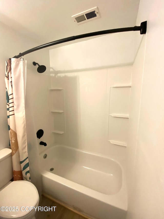 301 Teal Way, Kodiak, AK 99615 - bathroom featuring toilet and shower / bath combo with shower curtain