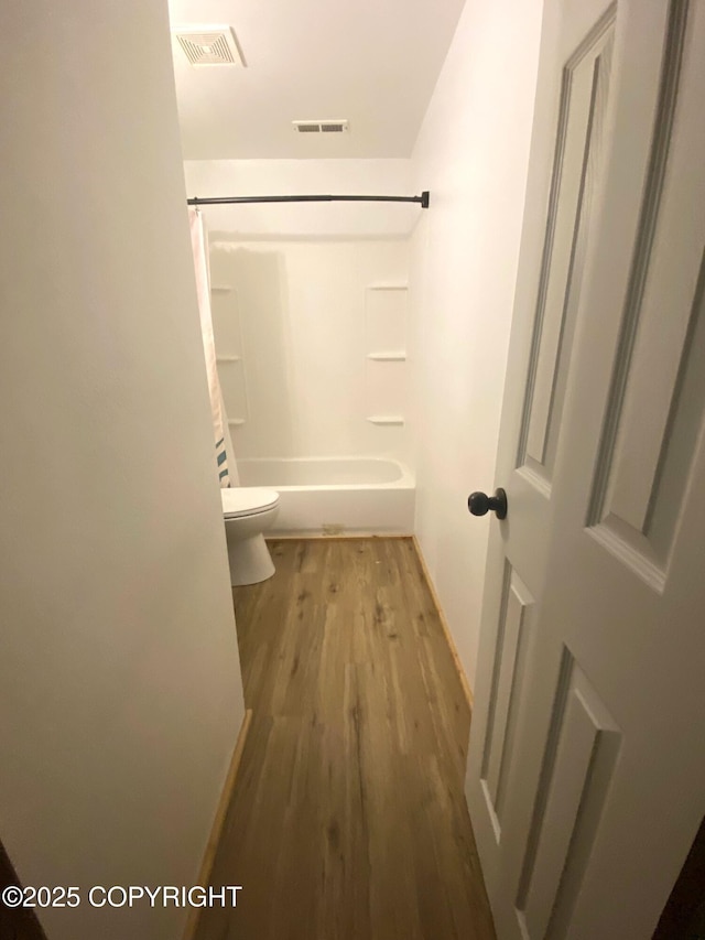 301 Teal Way, Kodiak, AK 99615 - full bath featuring wood finished floors, toilet, and washtub / shower combination