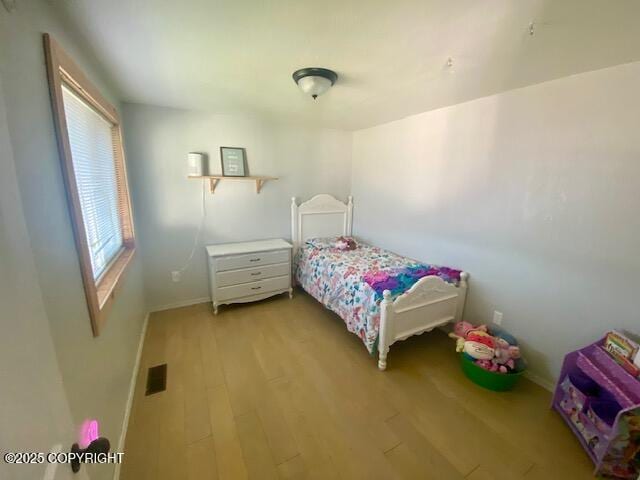 301 Teal Way, Kodiak, AK 99615 - bedroom with light wood-style flooring and baseboards