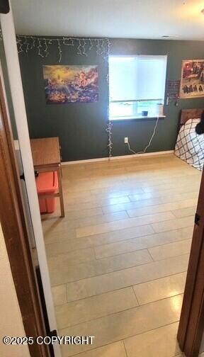 301 Teal Way, Kodiak, AK 99615 - unfurnished bedroom featuring wood finished floors