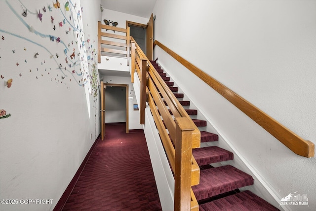 4109 Lynn Dr # 121, Anchorage, AK 99508 - stairs featuring baseboards and a towering ceiling