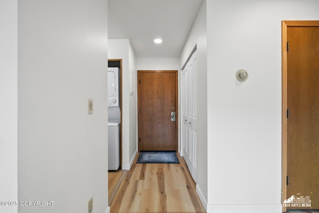 4109 Lynn Dr # 121, Anchorage, AK 99508 - hallway with stacked washer / dryer, light wood-style floors, and recessed lighting
