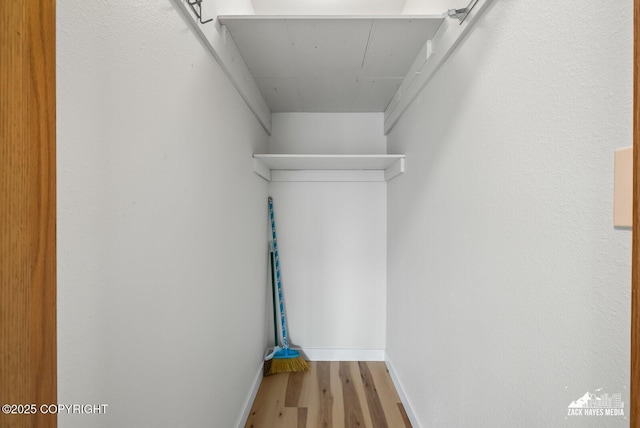 4109 Lynn Dr # 121, Anchorage, AK 99508 - walk in closet with wood finished floors