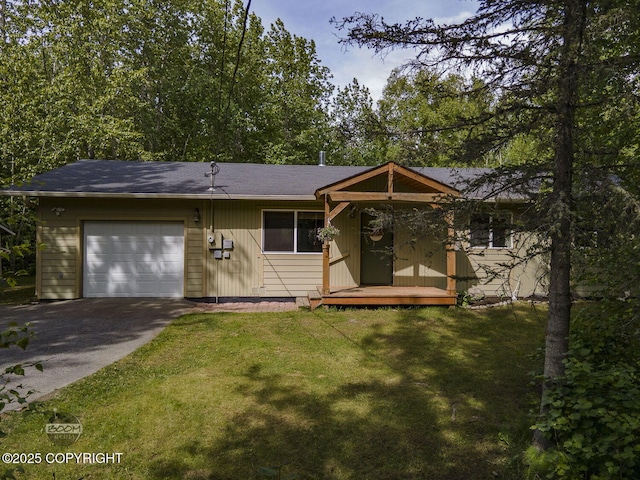 9845 E Lee Ann Dr, Palmer, AK 99645 - ranch-style home featuring an attached garage, asphalt driveway, and a front lawn