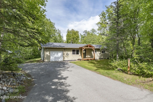 9845 E Lee Ann Dr, Palmer, AK 99645 - ranch-style home featuring a garage, asphalt driveway, and a front yard