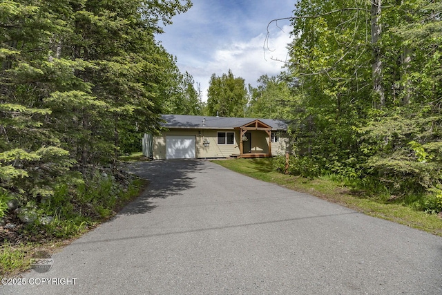 9845 E Lee Ann Dr, Palmer, AK 99645 - view of front of home with asphalt driveway and an attached garage