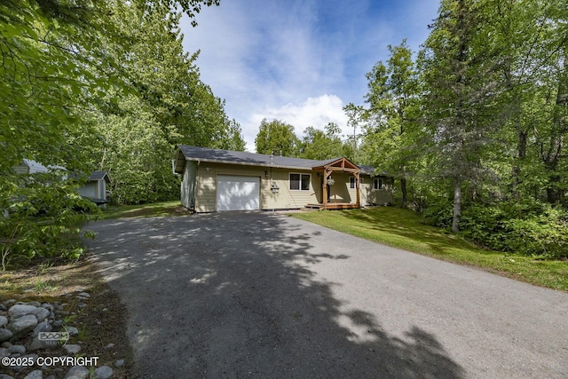 9845 E Lee Ann Dr, Palmer, AK 99645 - single story home with an attached garage, driveway, and a front yard
