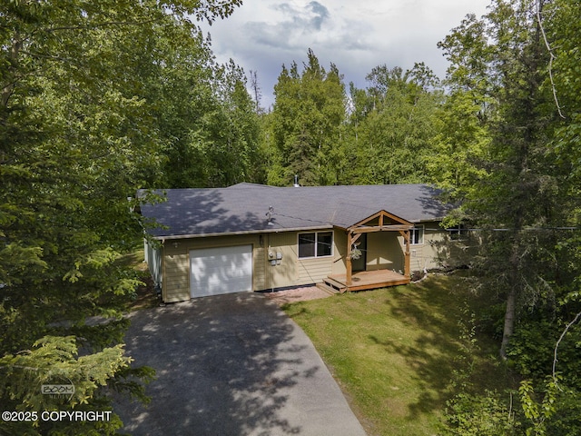 9845 E Lee Ann Dr, Palmer, AK 99645 - single story home featuring a garage, asphalt driveway, a wooden deck, and a shingled roof