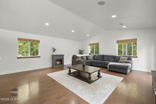 9845 E Lee Ann Dr, Palmer, AK 99645 - living area with vaulted ceiling, dark wood finished floors, recessed lighting, a lit fireplace, and baseboards