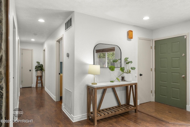 9845 E Lee Ann Dr, Palmer, AK 99645 - foyer featuring wood finished floors, recessed lighting, baseboards, and a textured ceiling