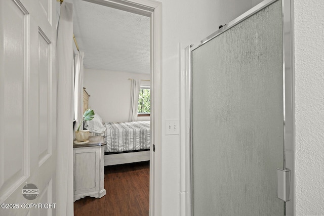 9845 E Lee Ann Dr, Palmer, AK 99645 - bedroom with a textured ceiling and wood finished floors