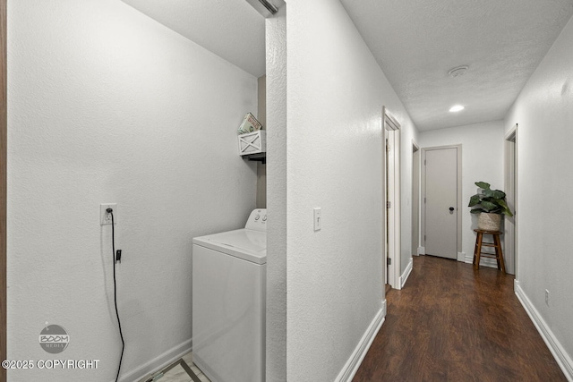 9845 E Lee Ann Dr, Palmer, AK 99645 - laundry area featuring washer / dryer, wood finished floors, and baseboards