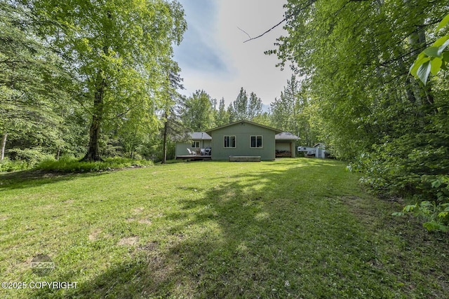 9845 E Lee Ann Dr, Palmer, AK 99645 - view of green lawn with a wooden deck