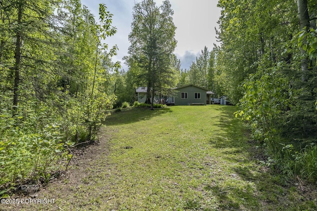 9845 E Lee Ann Dr, Palmer, AK 99645 - view of green lawn with a wooded view