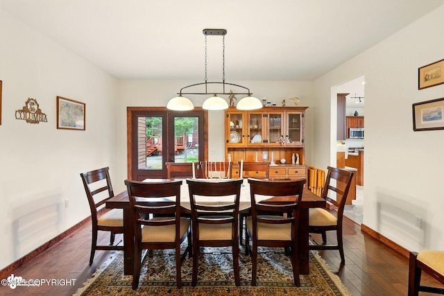 34952 Treeline Ave, Soldotna, AK 99669 - dining space with dark wood finished floors and baseboards