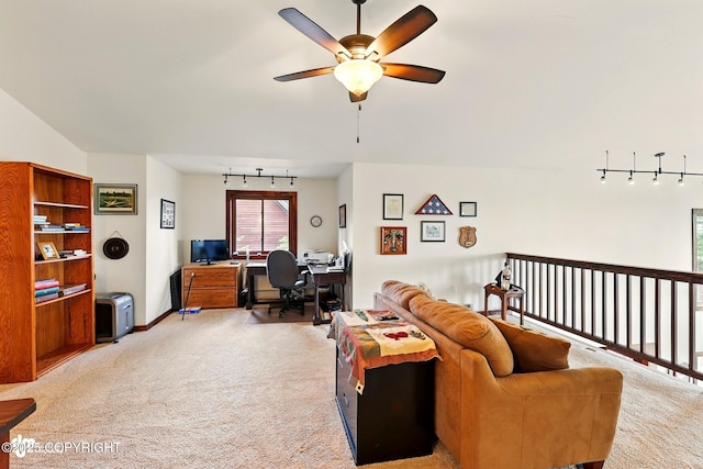 34952 Treeline Ave, Soldotna, AK 99669 - living area featuring a desk, rail lighting, light carpet, and ceiling fan