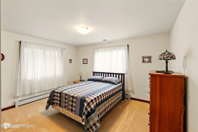 34952 Treeline Ave, Soldotna, AK 99669 - bedroom with baseboard heating, carpet flooring, and multiple windows
