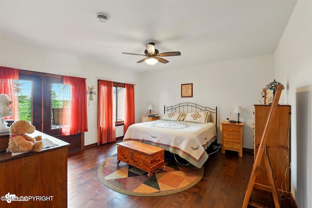34952 Treeline Ave, Soldotna, AK 99669 - bedroom with access to exterior, dark wood-style flooring, and a ceiling fan