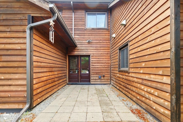 34952 Treeline Ave, Soldotna, AK 99669 - entrance to property with french doors and a patio area
