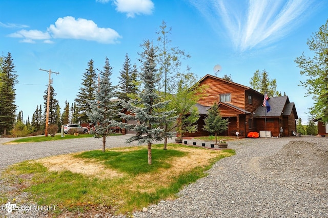 34952 Treeline Ave, Soldotna, AK 99669 - log home featuring gravel driveway