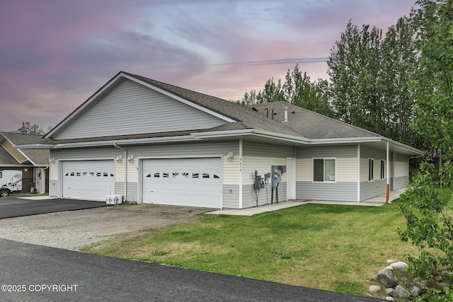 9650 E Forest Grove Cir # 10B, Palmer, AK 99645 - view of front facade featuring driveway, a front lawn, an attached garage, and a shingled roof