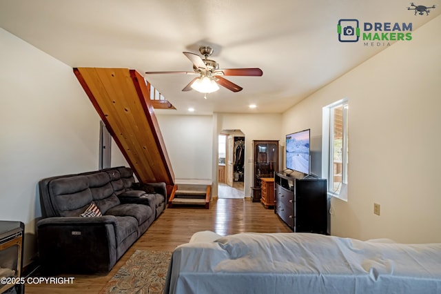 3745 W Machen Rd, Wasilla, AK 99623 - living room with wood finished floors, a ceiling fan, stairs, and recessed lighting