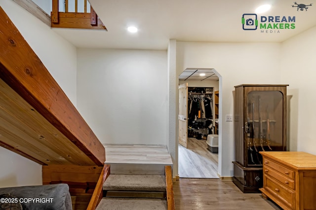 3745 W Machen Rd, Wasilla, AK 99623 - corridor with light wood-style floors, arched walkways, and recessed lighting