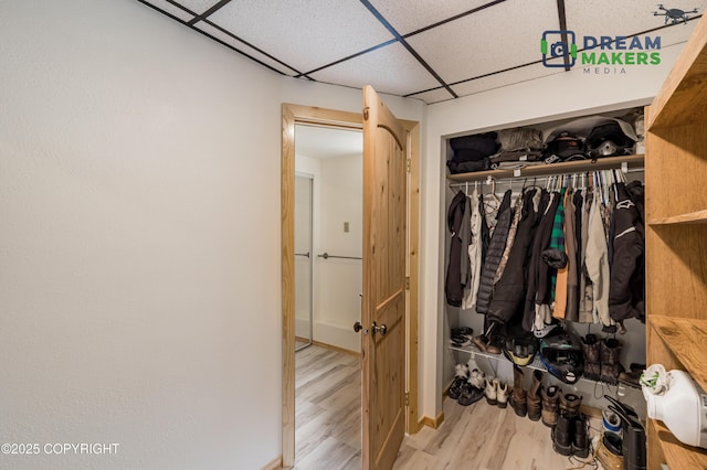3745 W Machen Rd, Wasilla, AK 99623 - walk in closet featuring a drop ceiling and wood finished floors