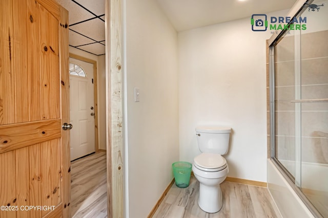 3745 W Machen Rd, Wasilla, AK 99623 - bathroom featuring wood finished floors and combined bath / shower with glass door