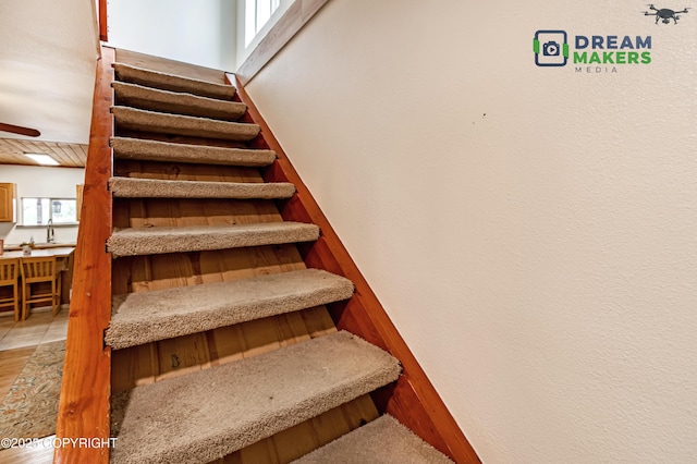 3745 W Machen Rd, Wasilla, AK 99623 - stairway featuring wood finished floors and ceiling fan