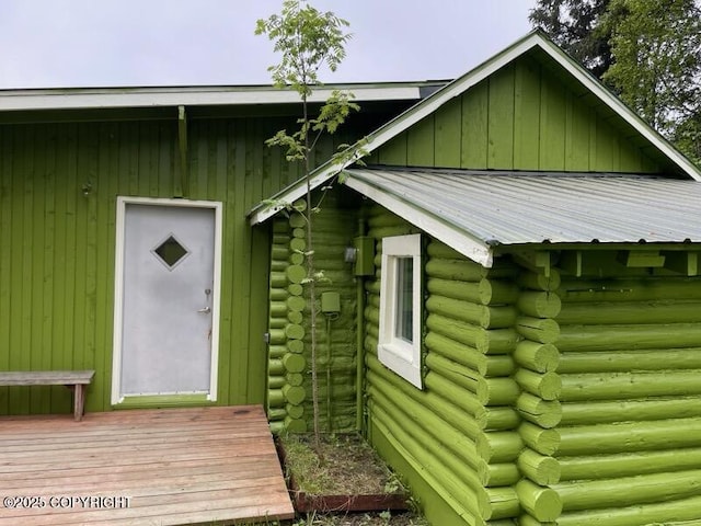 4075 Mattox Rd, Homer, AK 99603 - view of side of home featuring log siding and metal roof