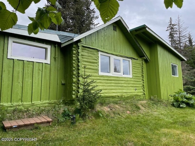 4075 Mattox Rd, Homer, AK 99603 - view of side of property featuring log exterior and board and batten siding