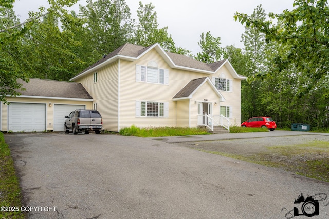 500 W Roy Rd, Wasilla, AK 99654 - traditional-style home featuring asphalt driveway, a shingled roof, and an attached garage