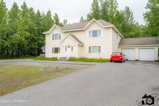 500 W Roy Rd, Wasilla, AK 99654 - traditional home featuring driveway, an attached garage, a shingled roof, and view of wooded area