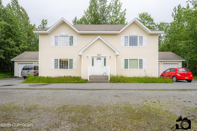 500 W Roy Rd, Wasilla, AK 99654 - traditional-style home with an attached garage and roof with shingles