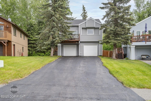 19113 Sarichef Loop, Eagle River, AK 99577 - view of front of property featuring an attached garage, asphalt driveway, and a front lawn