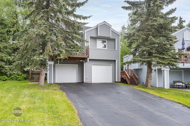 19113 Sarichef Loop, Eagle River, AK 99577 - view of front facade featuring stairway, asphalt driveway, a front yard, and an attached garage