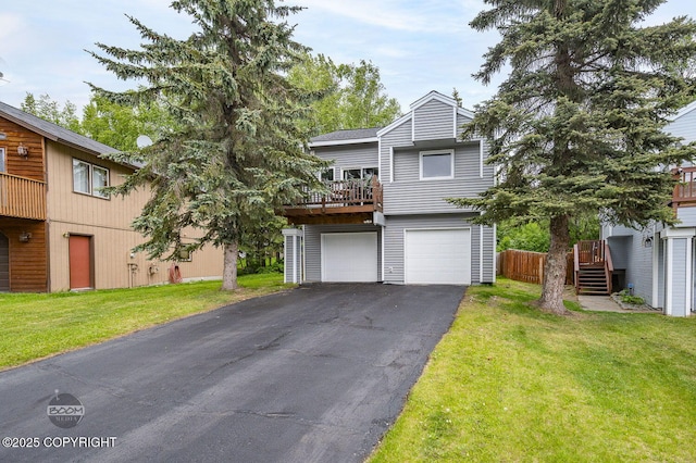 19113 Sarichef Loop, Eagle River, AK 99577 - view of front of property with asphalt driveway, an attached garage, and a front lawn