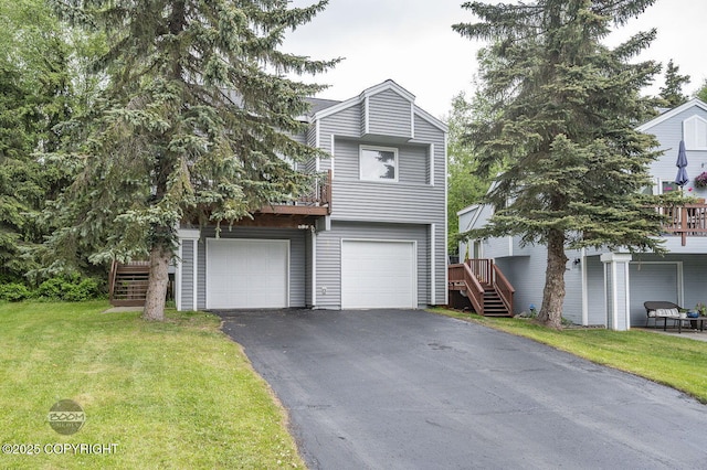 19113 Sarichef Loop, Eagle River, AK 99577 - view of front of home featuring asphalt driveway, stairs, and a front yard
