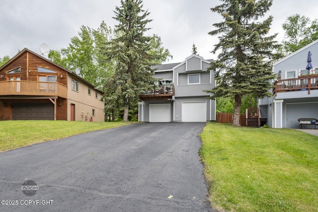 19113 Sarichef Loop, Eagle River, AK 99577 - view of front facade featuring an attached garage, driveway, a front lawn, and a balcony