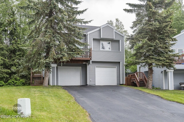 19113 Sarichef Loop, Eagle River, AK 99577 - view of front of home featuring asphalt driveway, stairway, a front yard, and an attached garage