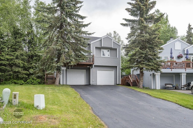 19113 Sarichef Loop, Eagle River, AK 99577 - tri-level home featuring asphalt driveway, a front yard, an attached garage, and stairway