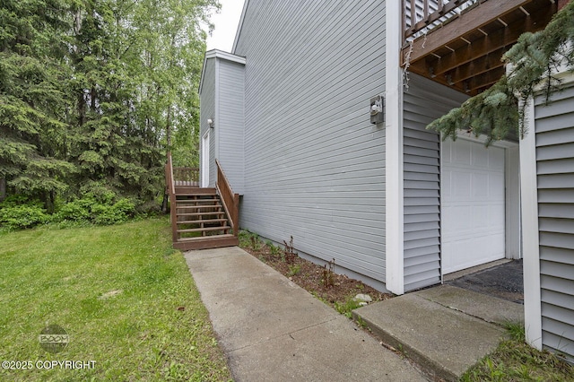 19113 Sarichef Loop, Eagle River, AK 99577 - view of home's exterior featuring a lawn, stairs, a wooden deck, and a garage