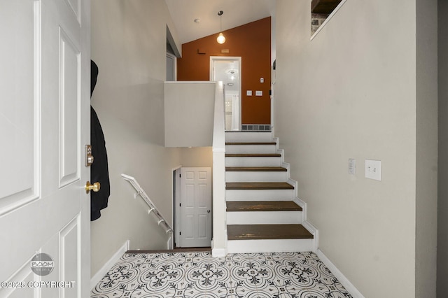 19113 Sarichef Loop, Eagle River, AK 99577 - stairs featuring lofted ceiling and baseboards