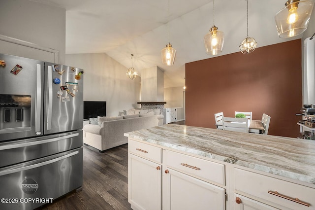 19113 Sarichef Loop, Eagle River, AK 99577 - kitchen featuring stainless steel fridge, vaulted ceiling, dark wood-style floors, white cabinetry, and pendant lighting