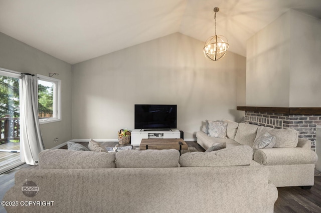 19113 Sarichef Loop, Eagle River, AK 99577 - living room featuring vaulted ceiling, a chandelier, dark wood-style flooring, and baseboards